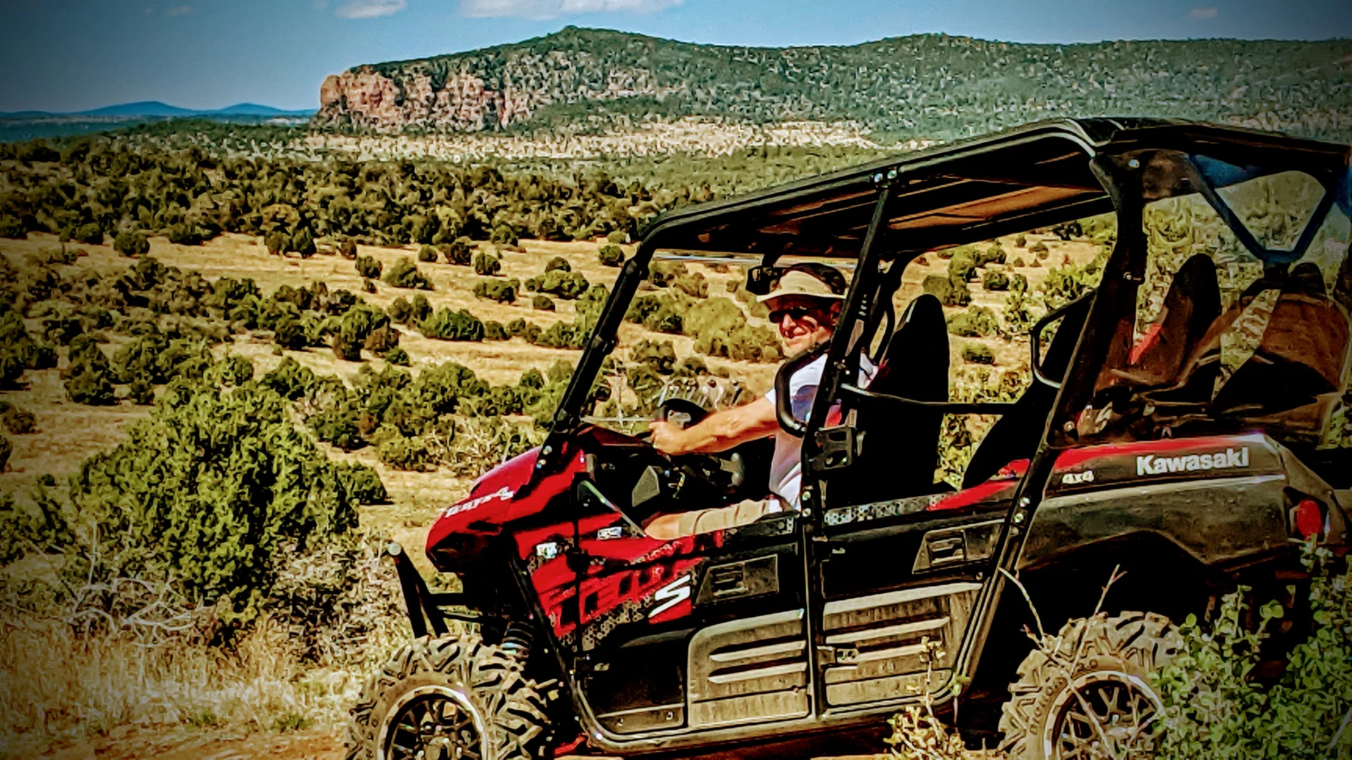 Dave P Kawasaki side by side 4 seater above Hardscrable Road rte 428. Mogollon Rim in the background